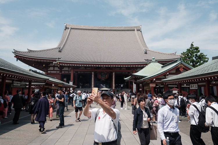 A modern moment in an old place. Technology and its overlap with long traditions is an interesting intersection. A spiritual heart is in the center of Tokyo…