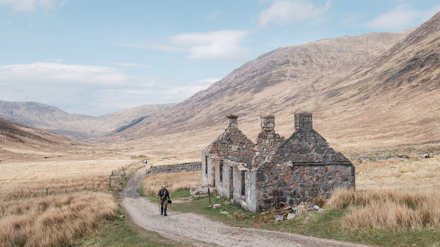 A man hikes an old trail, on a rare sunny day on the West Highland Way.Context: Part of a pilgrimage to connect with family in Scotland (May 2024), here hiking the West Highland Way. –photoessay–