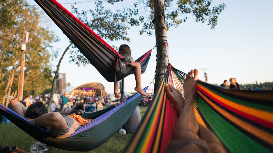 Hanging out and enjoying an evening of performances at the Winnipeg Folk Festival.Context: I was a photographer for the Winnipeg Folk Festival for seven years (2013-2020), building a wide collection of images including crowd moments like these that have been licensed further to organizations like Travel Manitoba. –link forthcoming–